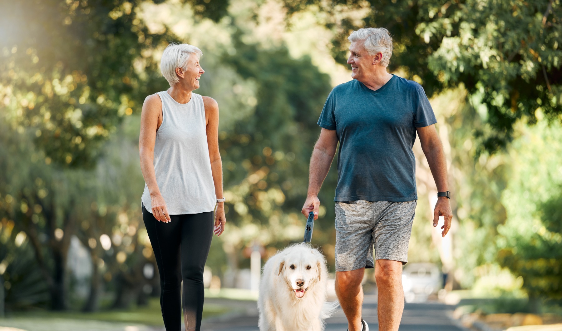 Exploring neighborhood Couple walking with dog